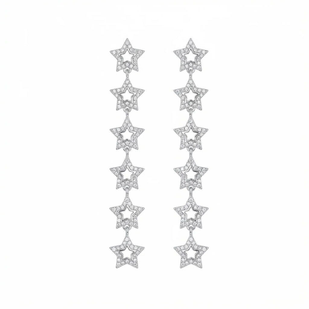 Rhodium plated silver cascading star drop earrings with cubic zirconia and off-white enamel in Dubai.