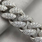 Close-up of cubic zirconia pave setting on a chunky rhodium-plated copper Cuban necklace in Dubai.
