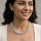 Chunky rhodium-plated copper pave Cuban necklace with cubic zirconia worn by a woman outdoors in Dubai.
