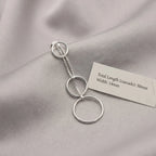 Silver circle cascade drop earring on grey fabric beside spec card showing 50mm total length and 14mm width