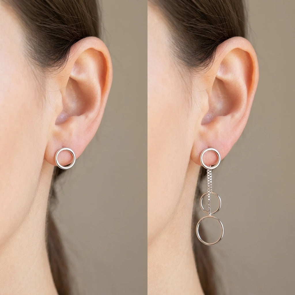 Silver circle drop earrings shown in two configurations: stud-only mode and full cascade drop mode on ear, white background