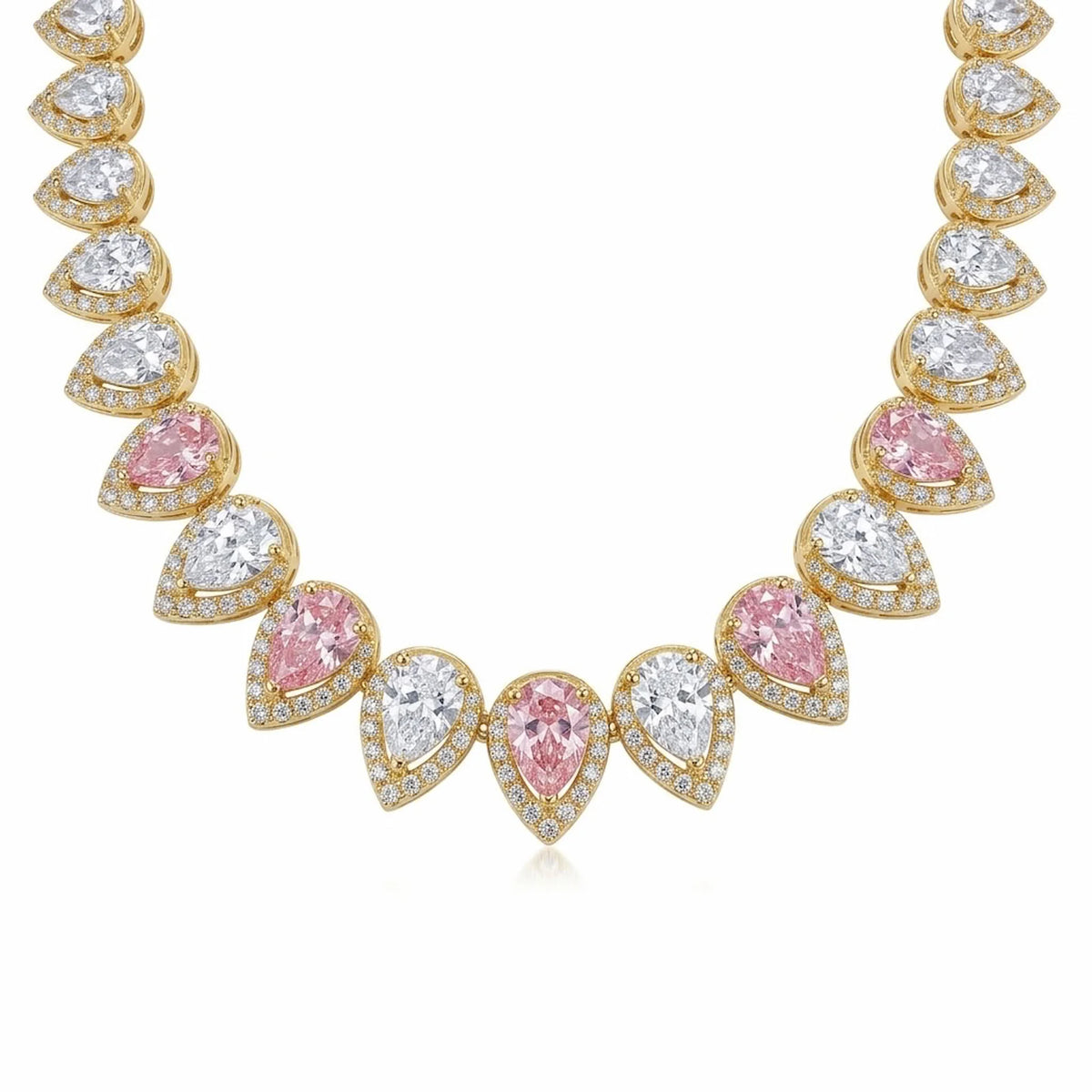 Close-up of alternating blush pink and white pear cut cubic zirconia on an 18k gold plated choker in Dubai.