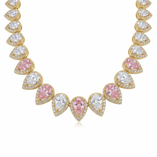 Close-up of alternating blush pink and white pear cut cubic zirconia on an 18k gold plated choker in Dubai.