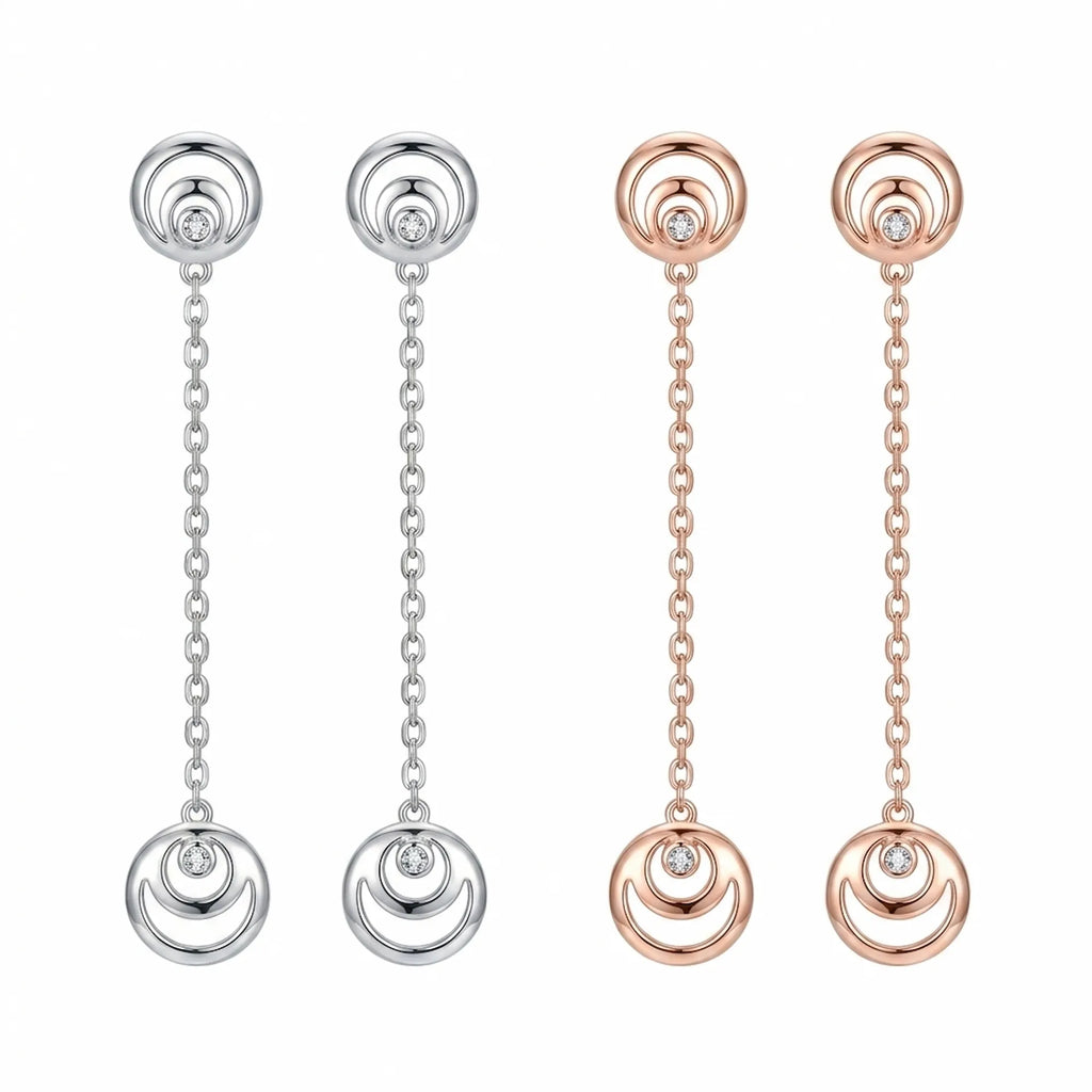 Crescent moon hilal drop earrings in rhodium silver and rose gold on white background — 925 sterling silver, 50mm chain, CZ