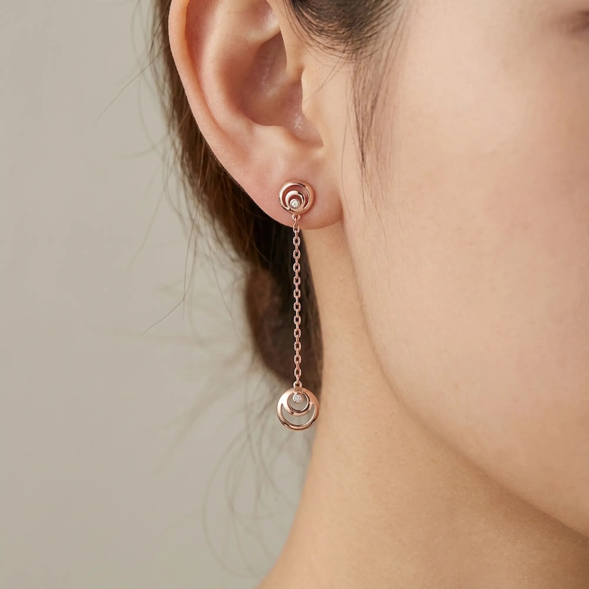 Rose gold crescent moon hilal drop earring worn on ear — 50mm drop length visible, 18K rose gold 925 silver