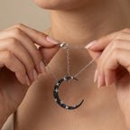 Hands showing adjustable lobster clasp and extender chain of crescent moon necklace — 925 silver, 40+5 cm length