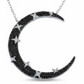 Statement crescent moon necklace in 925 silver — black cubic zircon pavé with white star accents on rhodium chain, white background