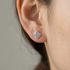 Model wearing 6mm pyramid stud earrings in 925 silver — scale and everyday fit reference