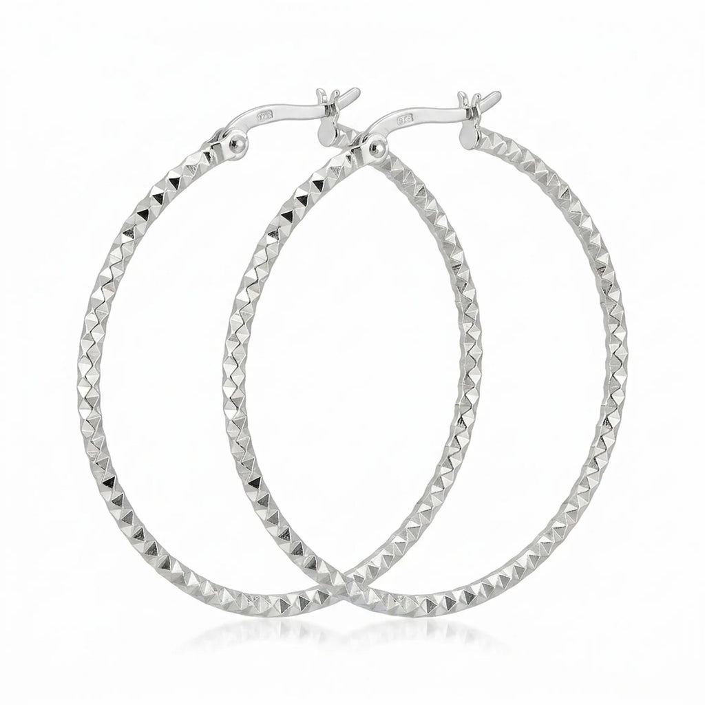 Pair of 925 sterling silver diamond-cut hoop earrings, 40 mm, faceted high-polish finish. Luna Dura.