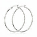Pair of 925 sterling silver diamond-cut hoop earrings, 40 mm, faceted high-polish finish. Luna Dura.