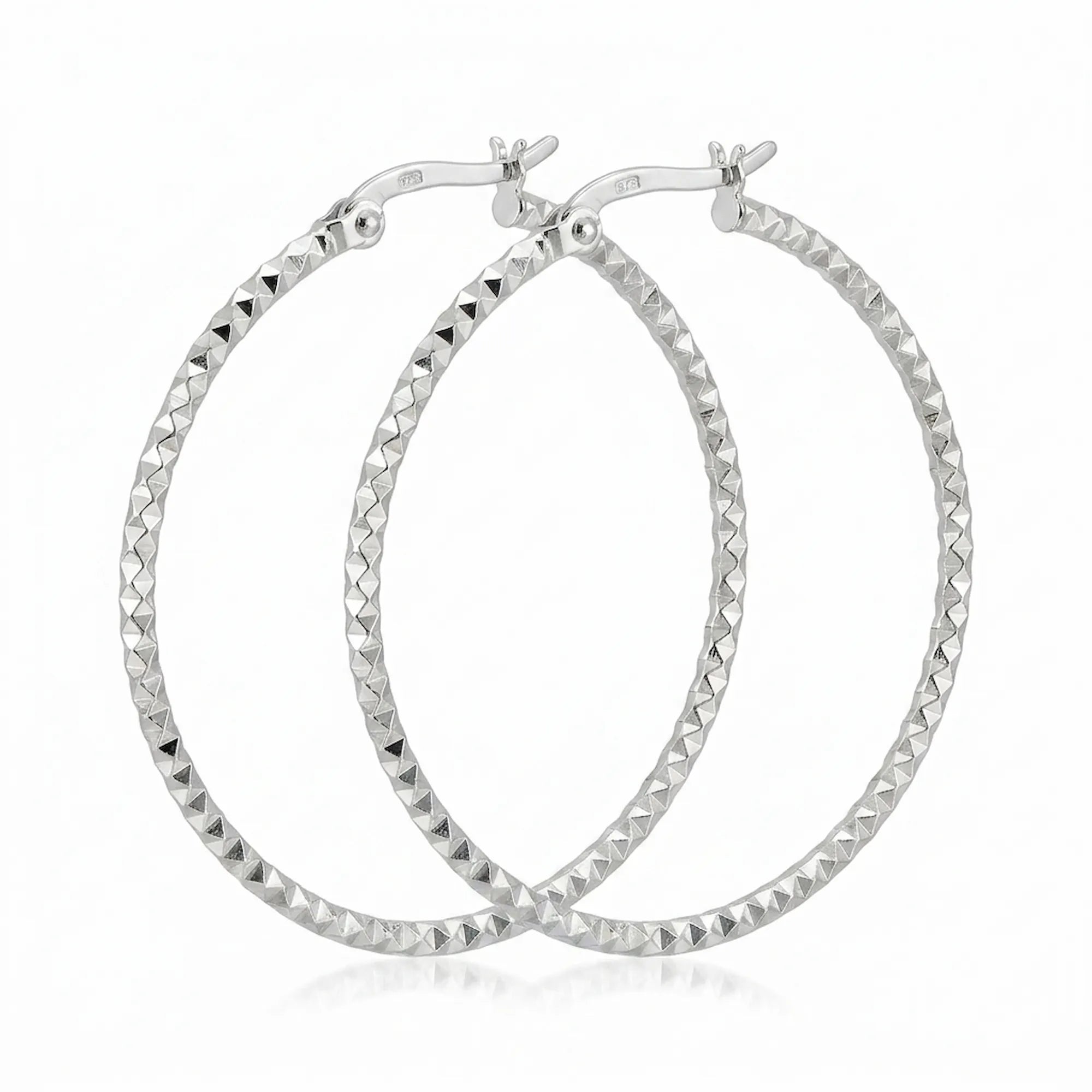 Pair of 925 sterling silver diamond-cut hoop earrings, 40 mm, faceted high-polish finish. Luna Dura.