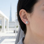 Dome silver stud earring worn on ear with Burj Khalifa in background — 9mm 925 sterling silver, flush CZ, Dubai