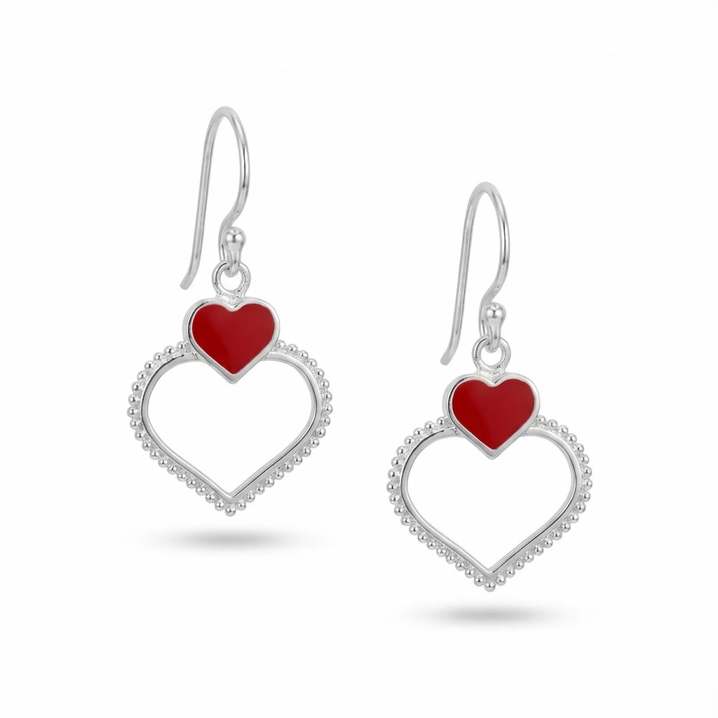  Double heart drop earrings in sterling silver with red enamel upper heart and milgrain-beaded open lower heart, white background