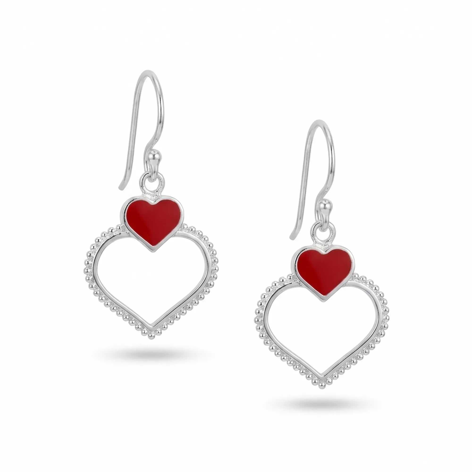  Double heart drop earrings in sterling silver with red enamel upper heart and milgrain-beaded open lower heart, white background