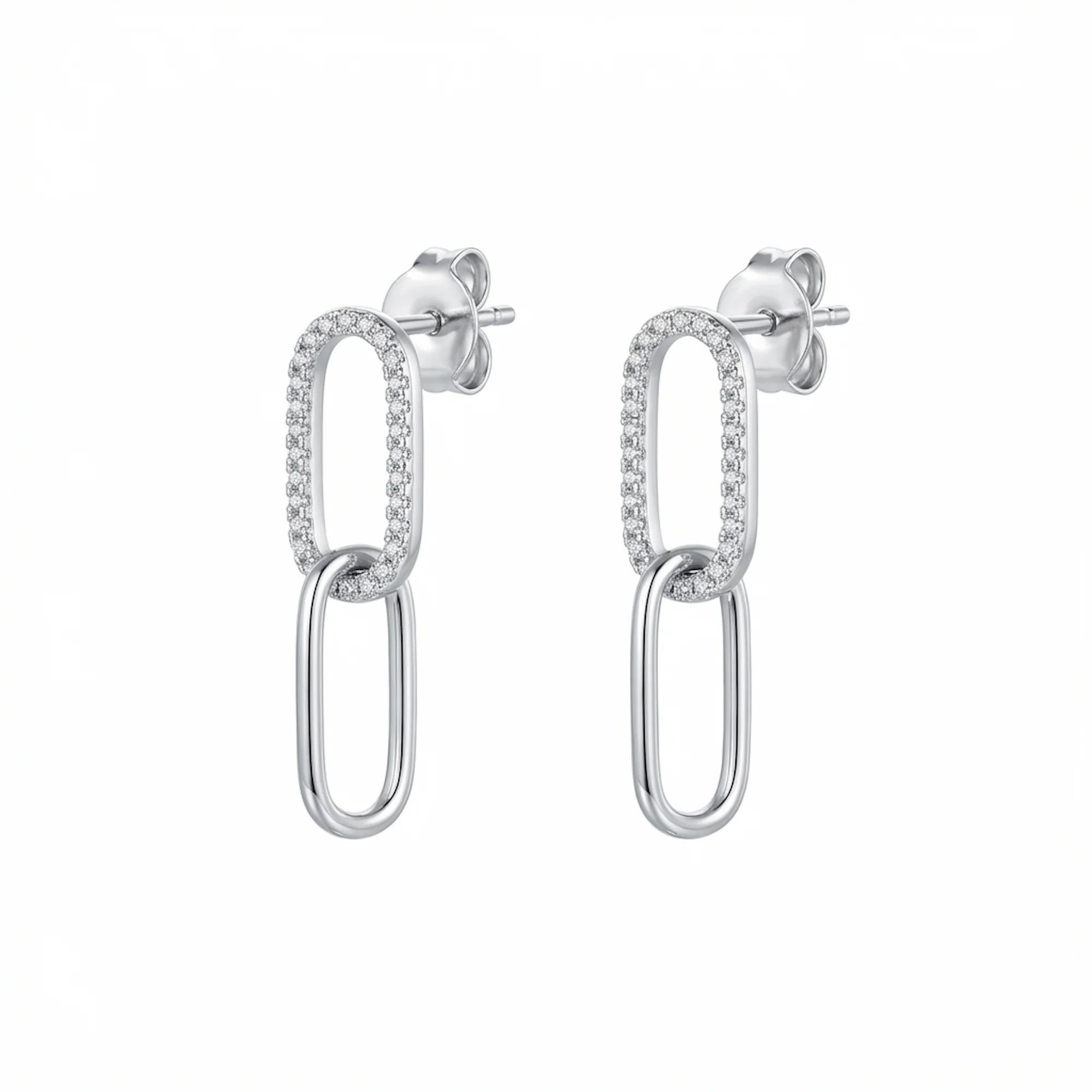 Double link silver earrings with clear stones on the top loop photographed in Dubai on a white background.