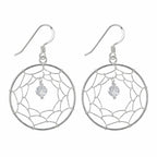 Dreamcatcher drop earrings in 925 sterling silver with hand-woven wire web and cubic zirconia bead, white background