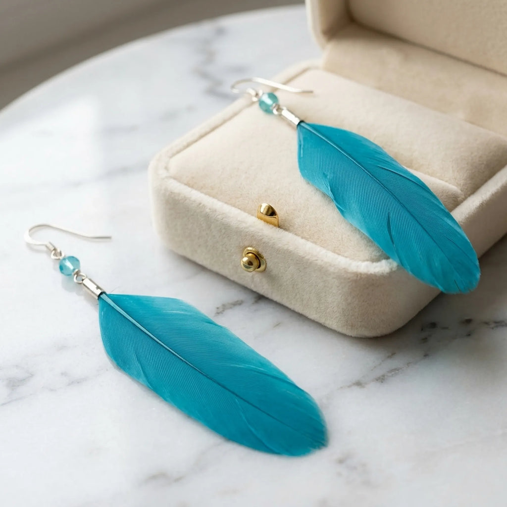 Electric blue natural feather earring — crystal bead and 925 silver shepherd hook detail