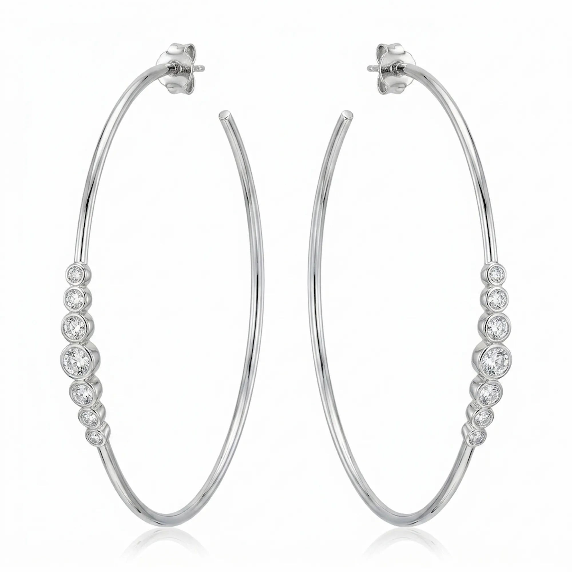 Pair of 70 mm rhodium-finished 925 silver hoop earrings with graduated bezel cubic zirconia. Luna Dura.