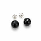 Close-up of faceted black 08 mm spherical earrings showing their geometric surfaces, silver posts and butterfly backs.