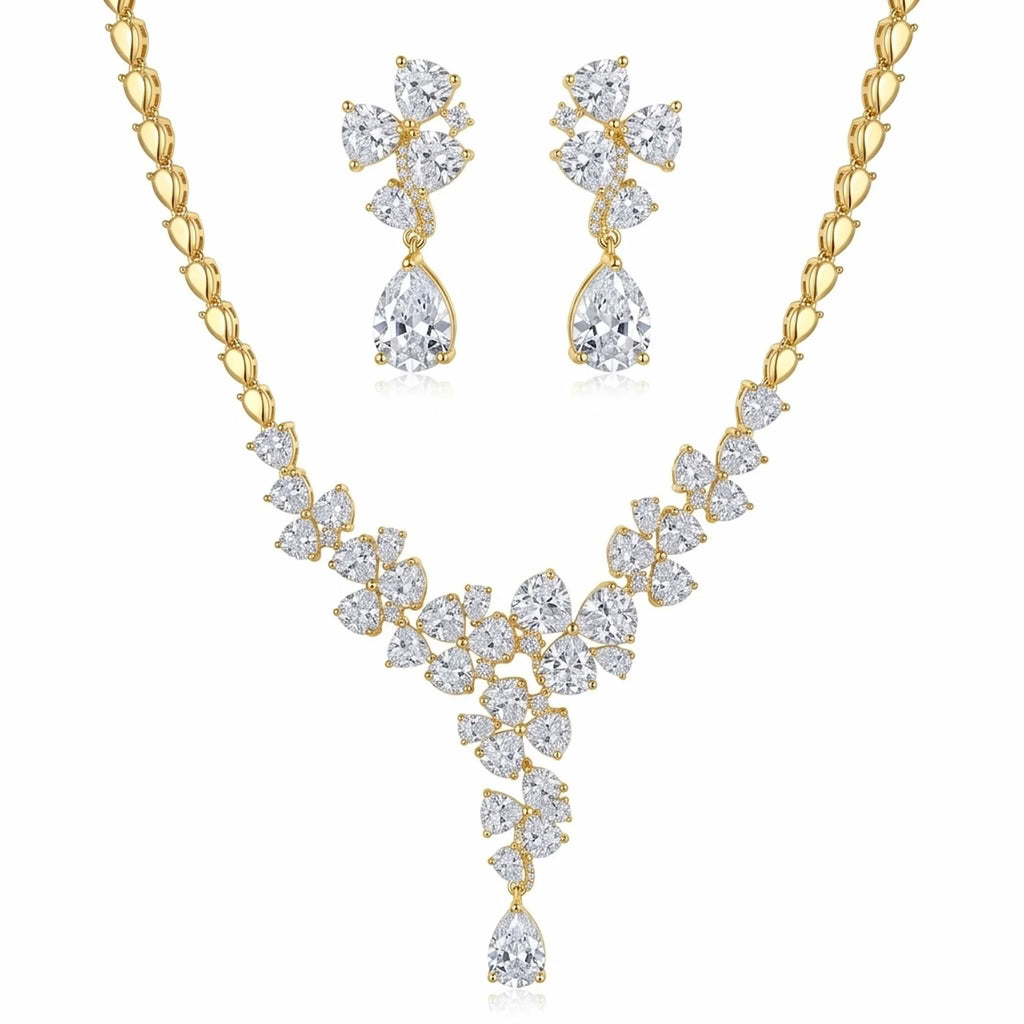 Floral cluster Y-drop necklace and earring set in 18k gold-plated cubic zirconia, displayed on a white stand in Dubai.