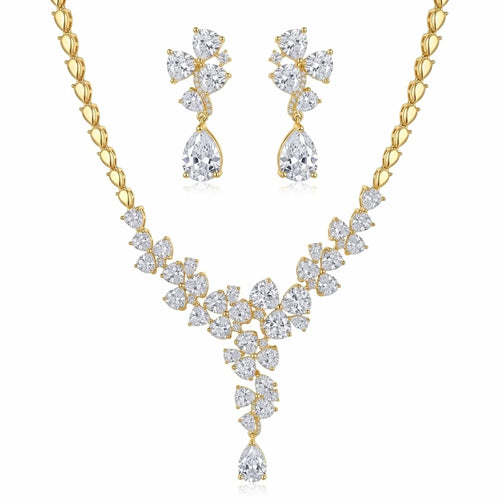 Floral cluster Y-drop necklace and earring set in 18k gold-plated cubic zirconia, displayed on a white stand in Dubai.