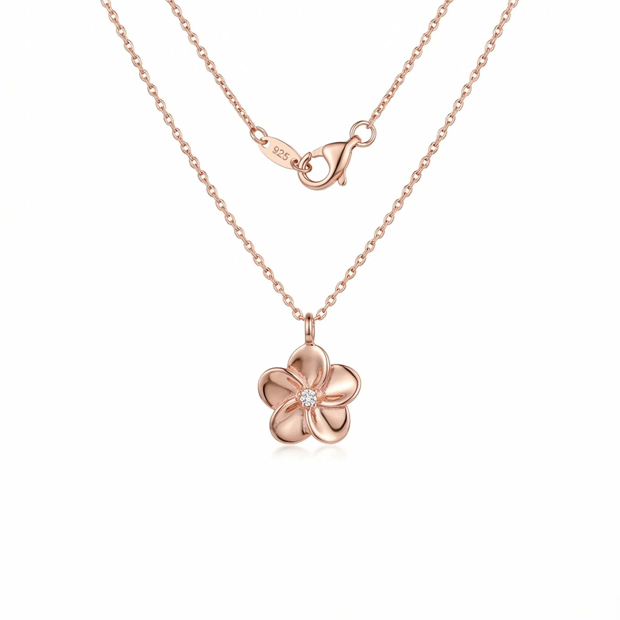 Rose gold floral pendant necklace with CZ centre on white background — 925 sterling silver chain and lobster clasp