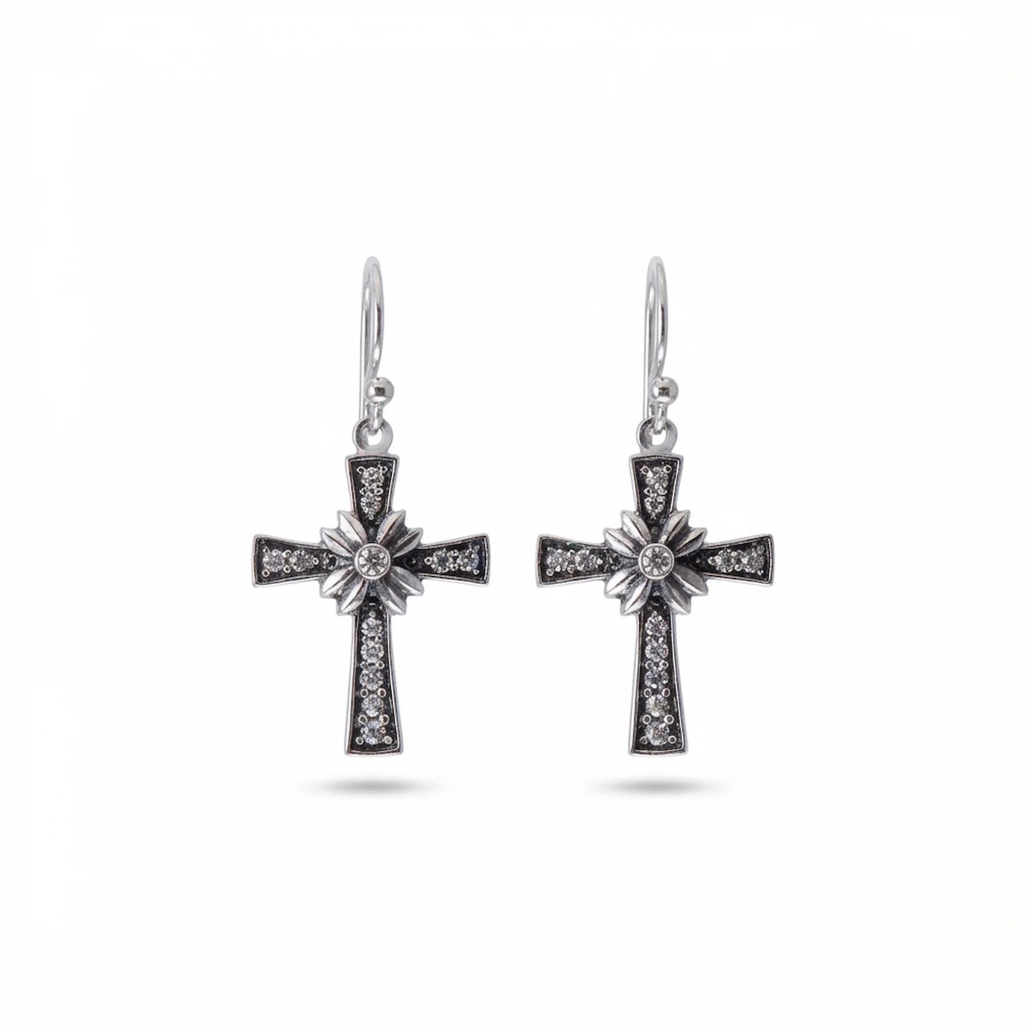 Oxidised 925 sterling silver floriated cross dangle earrings with pavé rhinestones on white background — French hook drop