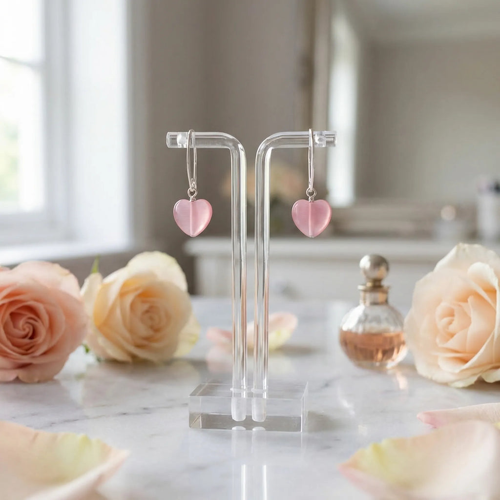 Frosted pink heart drop earrings on a stand with roses, romantic gift styling, Luna Dura Dubai