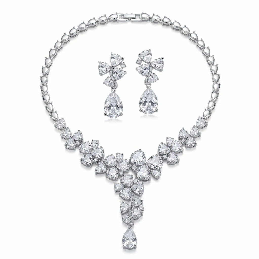 Full rhodium-plated cubic zirconia floral cluster Y-necklace and drop earrings set shown on a white background in Dubai.