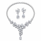 Full rhodium-plated cubic zirconia floral cluster Y-necklace and drop earrings set shown on a white background in Dubai.