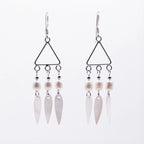 Geometric triangle 925 silver drop earrings with three pearls and shell teardrops against a white background.