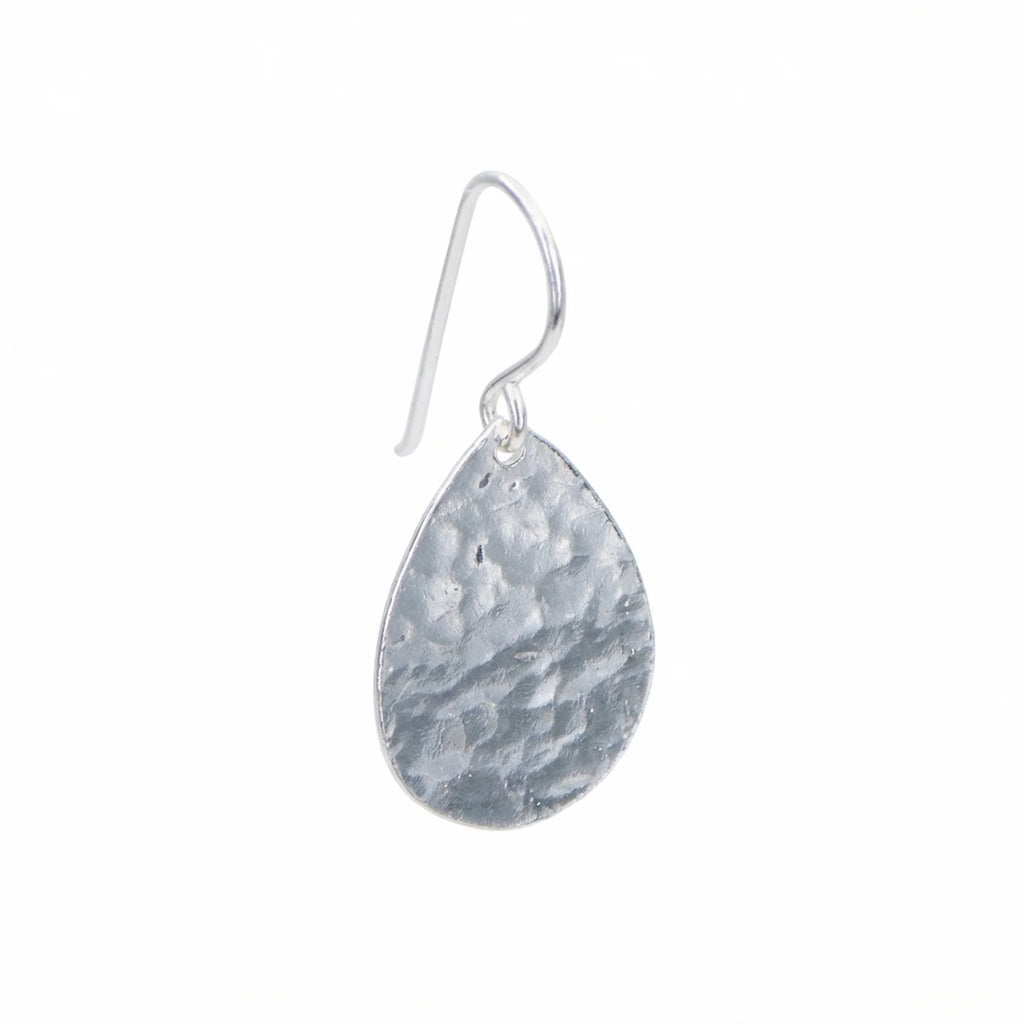 Single hammered teardrop 925 sterling silver drop earring with shepherd hook on a white background in Dubai.