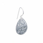 Single hammered teardrop 925 sterling silver drop earring with shepherd hook on a white background in Dubai.