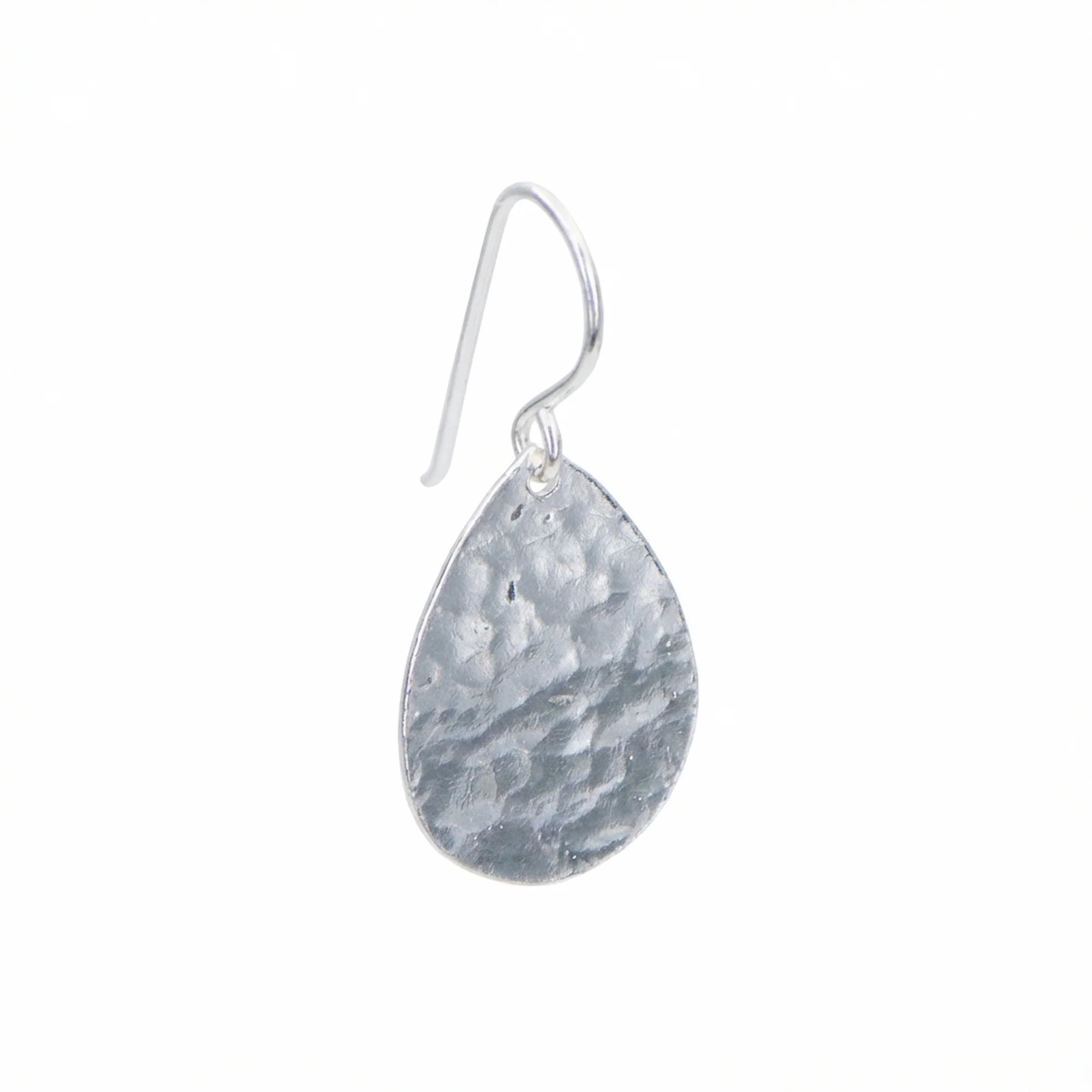 Single hammered teardrop 925 sterling silver drop earring with shepherd hook on a white background in Dubai.