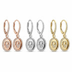 Hamsa oval drop earrings in rhodium silver, 18K gold and rose gold — three pavé CZ finishes on white background