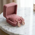 Rose gold Hamsa pavé drop earrings in pink velvet gift box on marble — symbolic jewelry gift UAE