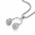 DJ headphone pendant necklace in 925 sterling silver with full CZ pave on earcups, shown in Dubai with thick box chain, white background.
