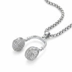 DJ headphone pendant necklace in 925 sterling silver with full CZ pave on earcups, shown on thick box chain, white background