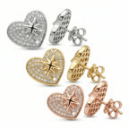 Rhodium, gold, and rose gold 925 silver pavé heart earrings with cubic zirconia arranged in Dubai.