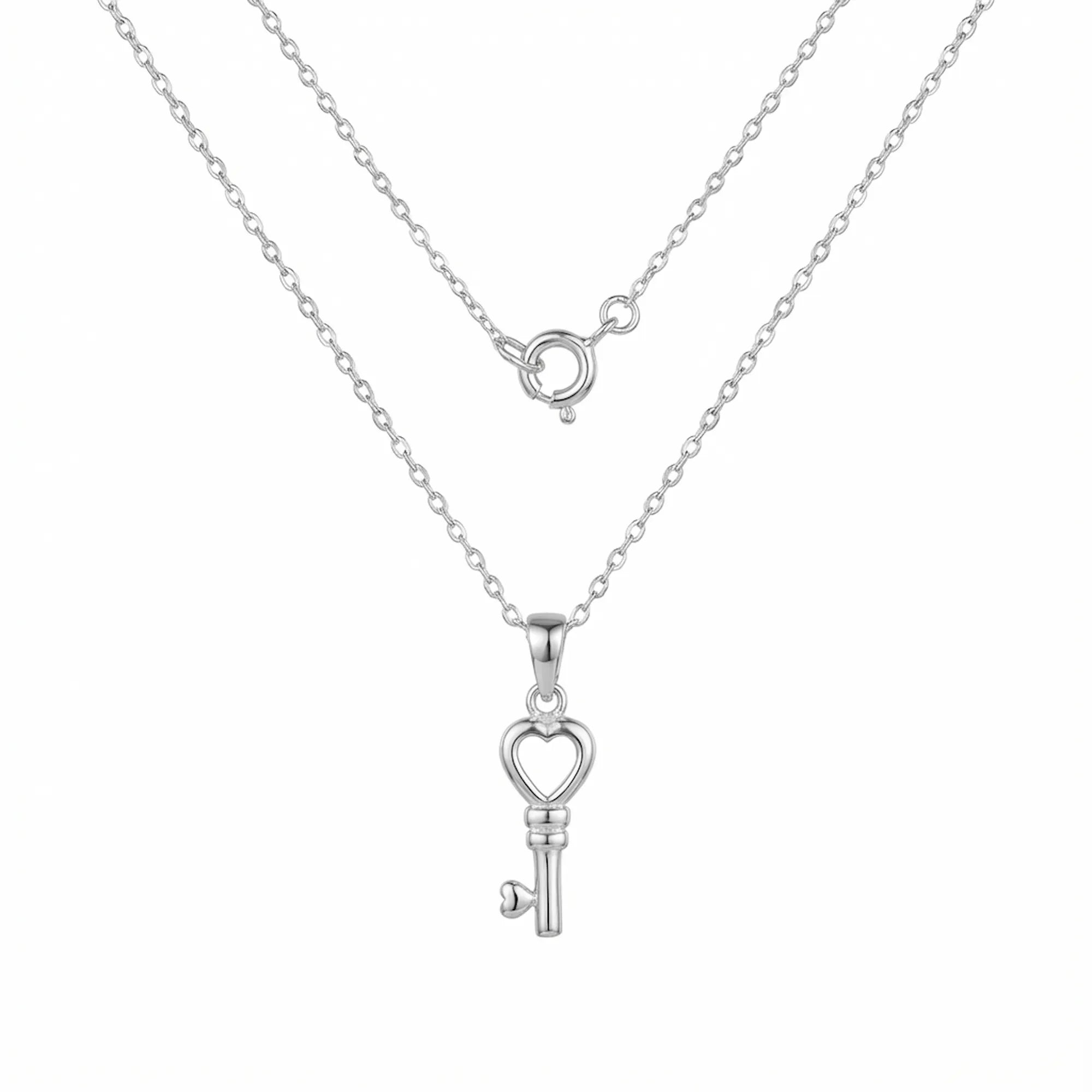 Heart key pendant necklace in polished 925 sterling silver — full 40cm cable chain and spring ring clasp on white background