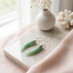 Green aventurine horn dangle earrings on marble tray — 925 silver cap, natural stone flat lay Dubai Luna Dura