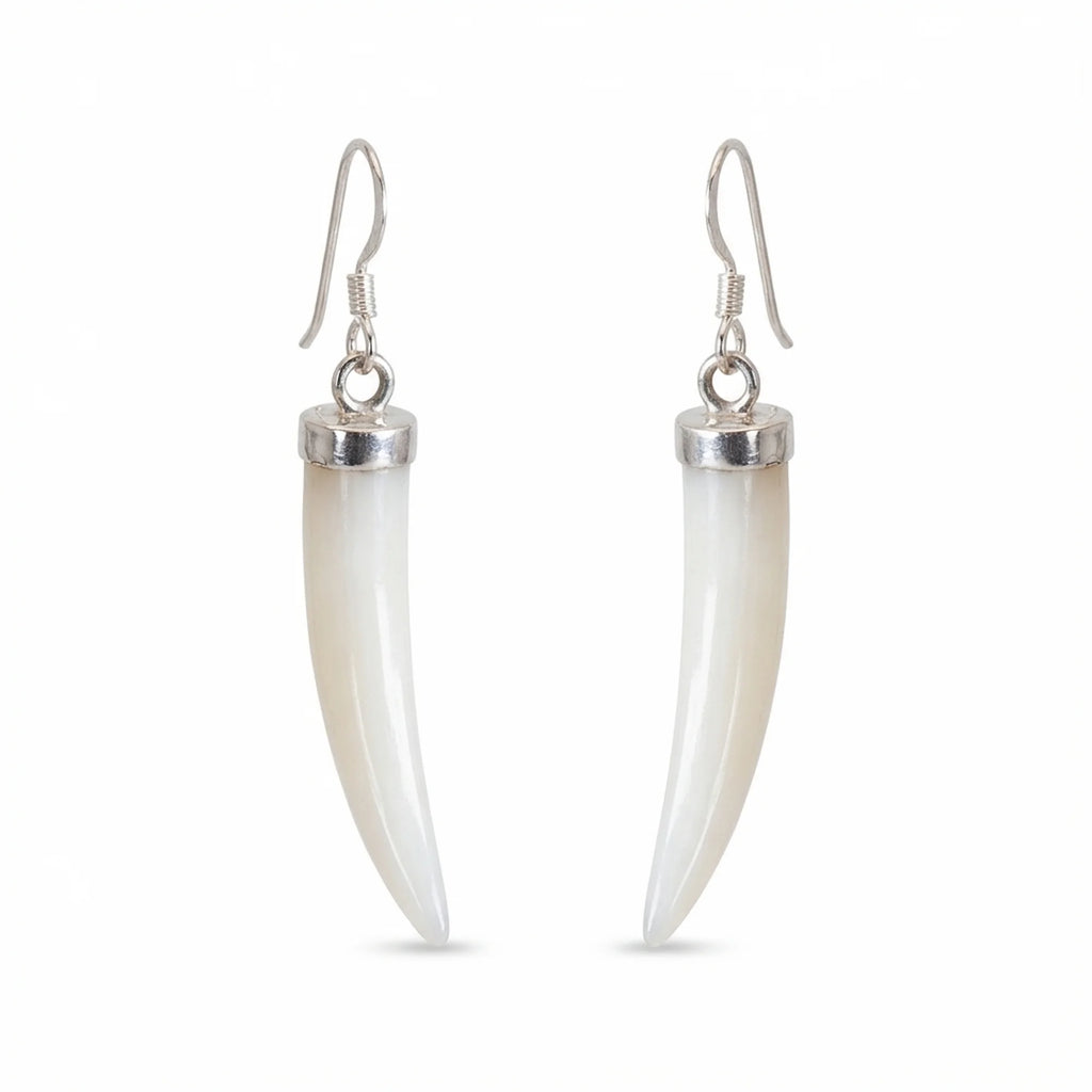A pair of drop earrings featuring curved, ivory-colored mother of pearl horns set in polished silver-tone metal with silver French hook ear wires, shown against a plain white background in Dubai.