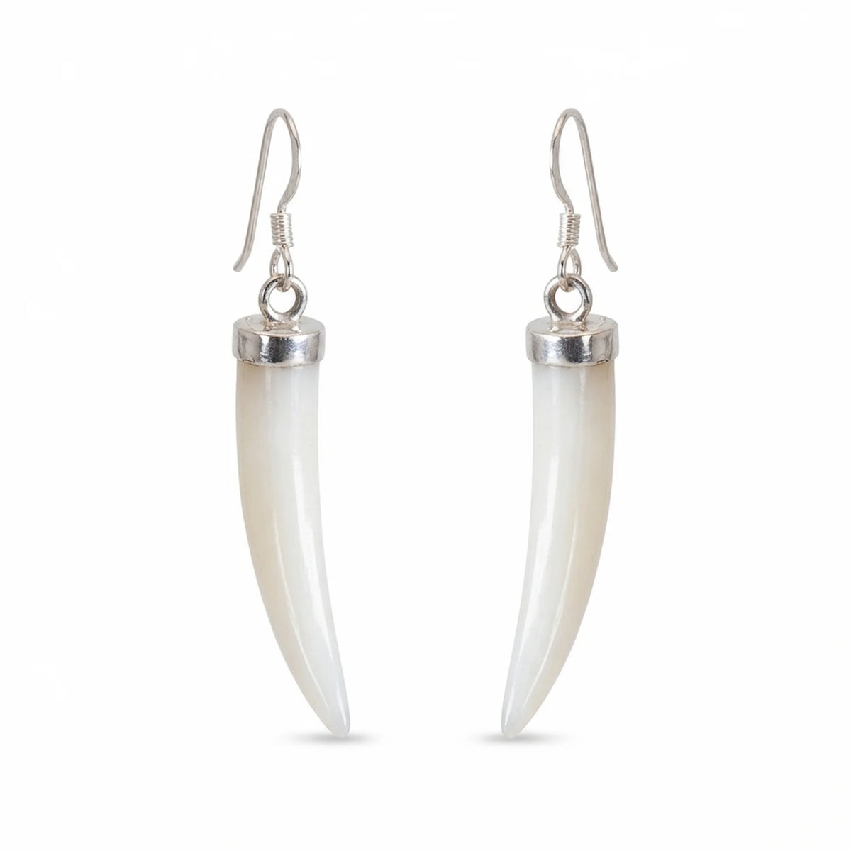 A pair of drop earrings featuring curved, ivory-colored mother of pearl horns set in polished silver-tone metal with silver French hook ear wires, shown against a plain white background in Dubai.
