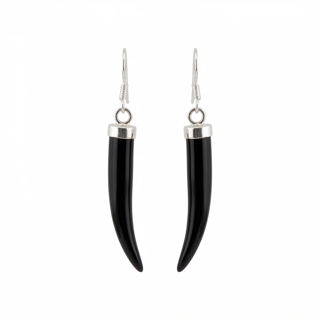 A pair of black horn or bone dangle earrings with polished silver-toned metal caps and fishhook wires, shown against a plain white background in Dubai.