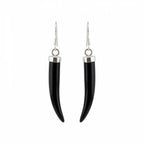 A pair of black horn or bone dangle earrings with polished silver-toned metal caps and fishhook wires, shown against a plain white background in Dubai.