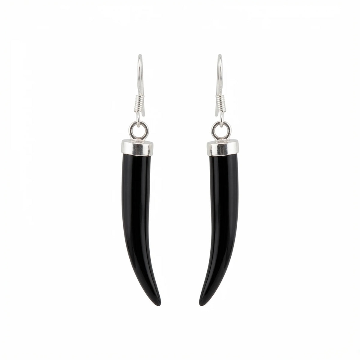 A pair of black horn or bone dangle earrings with polished silver-toned metal caps and fishhook wires, shown against a plain white background in Dubai.