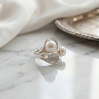Hosta leaf twin pearl ring in 925 silver on marble surface, lifestyle shot, Dubai