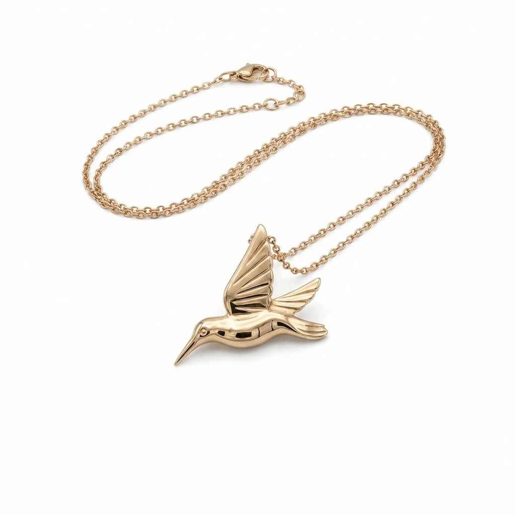 Gold-plated sterling silver hummingbird pendant necklace with a fine chain on a white background UAE.