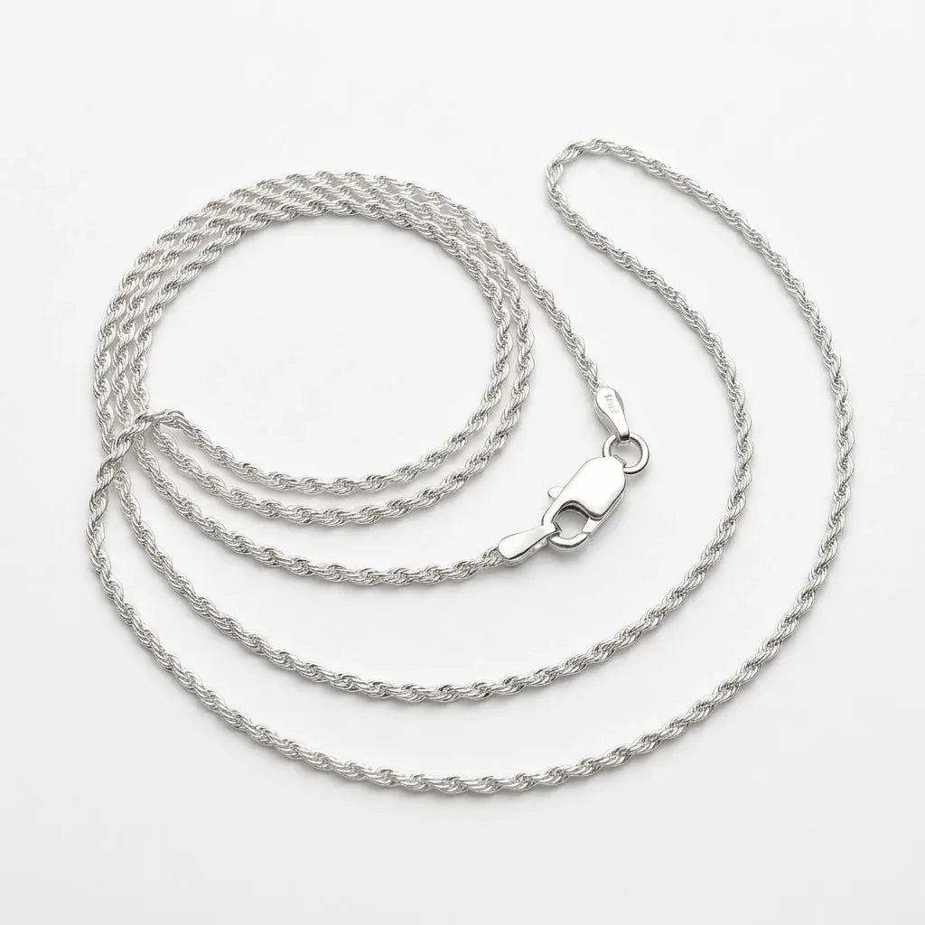 Fine 925 sterling silver rope chain arranged on a white background, showing its closely twisted links and lobster clasp.