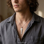 Man wearing an embossed 925 silver Jesus pendant with raised Christ figure, chain not included.